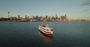The Love For All Boat in front of the Seattle skyline