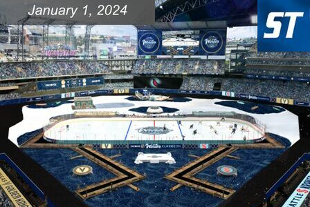 Aerial view of an outdoor hockey game at a large stadium. The ice rink features custom graphics, and a crowd fills the stands. A digital board shows the text 