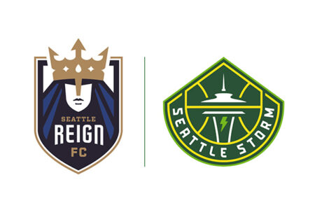 Logos for two sports teams: on the left, the Seattle Reign FC logo featuring a crowned face; on the right, the Seattle Storm logo with the Space Needle and a lightning bolt.