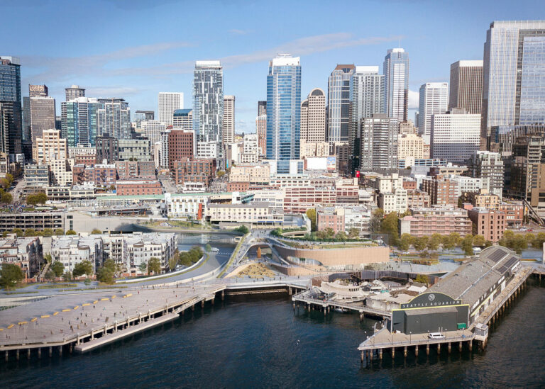 A vibrant city skyline with modern skyscrapers and various architectural styles is visible against a blue sky. In the foreground, there is a waterfront with piers and a mix of commercial and residential buildings.