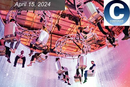 People sit in chairs suspended from the ceiling.