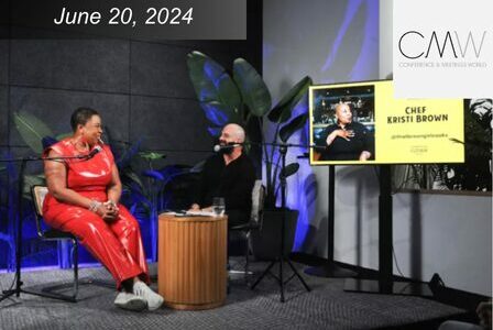 Black woman Chef Kristi Brown sits on stage with white man Mike Schiebel for live interview and podcast recording