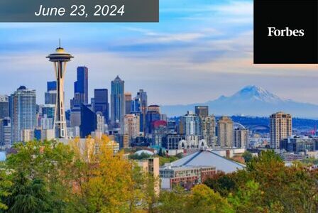 Seattle skyline with the Space Needle in view, surrounded by urban buildings. Mount Rainier is visible in the background. The image includes the date 