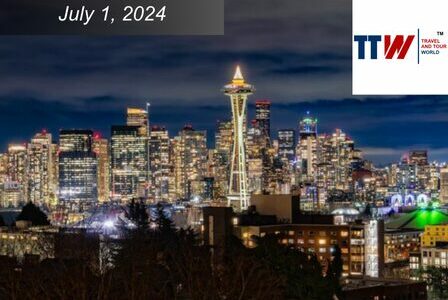 Seattle skyline at night, lit up. The Space Needle is center.