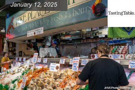A bustling scene at Pike Place Market, featuring a seafood stall with various fresh fish and shellfish on ice.