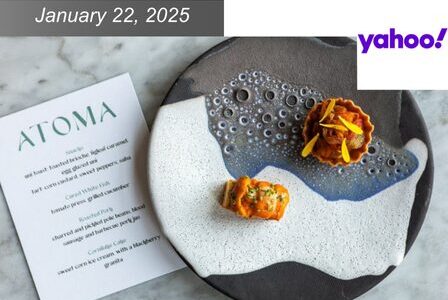 A creatively plated dish with two gourmet appetizers on a textured, artistic plate. Next to it, a menu from 