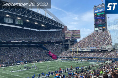 Lumen Field during a sports game. Field full of people in the stadium.