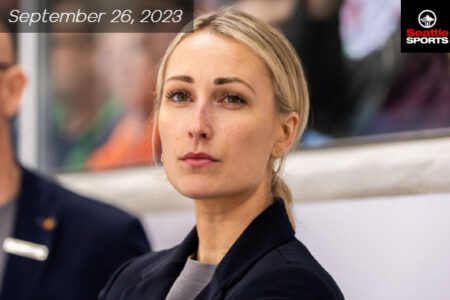 Caucasian middle age women with blonde hair and her hair tied back in a pony tail.