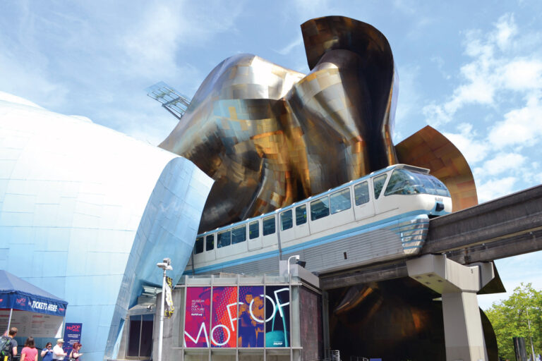 The Seattle Center Monorail on the tracks coming out of the Museum of Pop Culture.