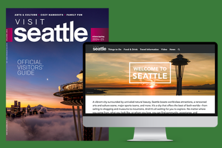 The image shows a Visit Seattle magazine and a computer screen displaying a Seattle-themed webpage. The magazine cover features the Space Needle above clouds, while the webpage welcomes visitors to Seattle with a similar Space Needle image background.