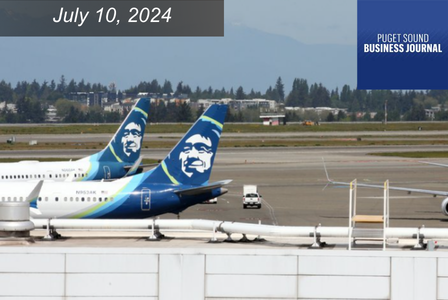 Alaska Airlines planes with mountains in the background