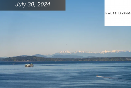 Expansive Elliott Bay on a clear day, with mountain range in background