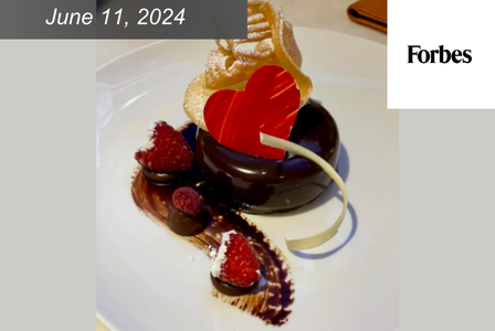 Chocolate pastry with raspberries and a decorative heart.