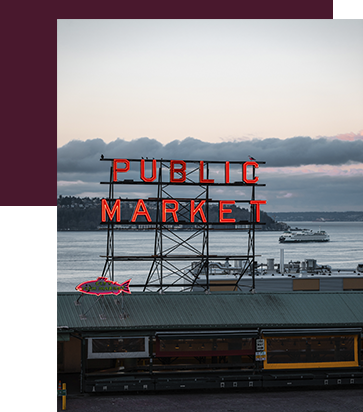 The Public Market neon sign at Pike Place Market at dusk