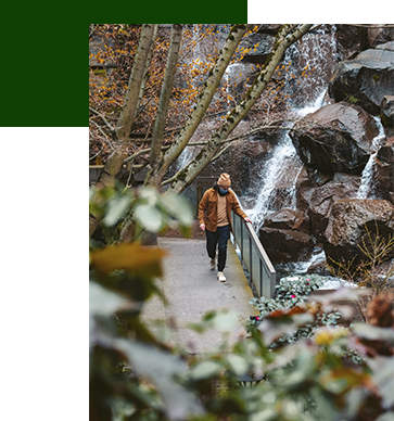 Image of man walking in the Waterfall Garden in Pioneer Square